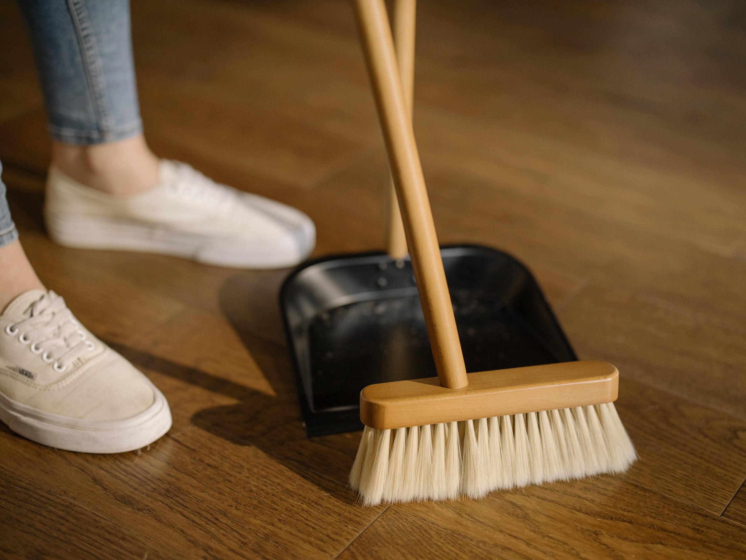 person sweeping floor