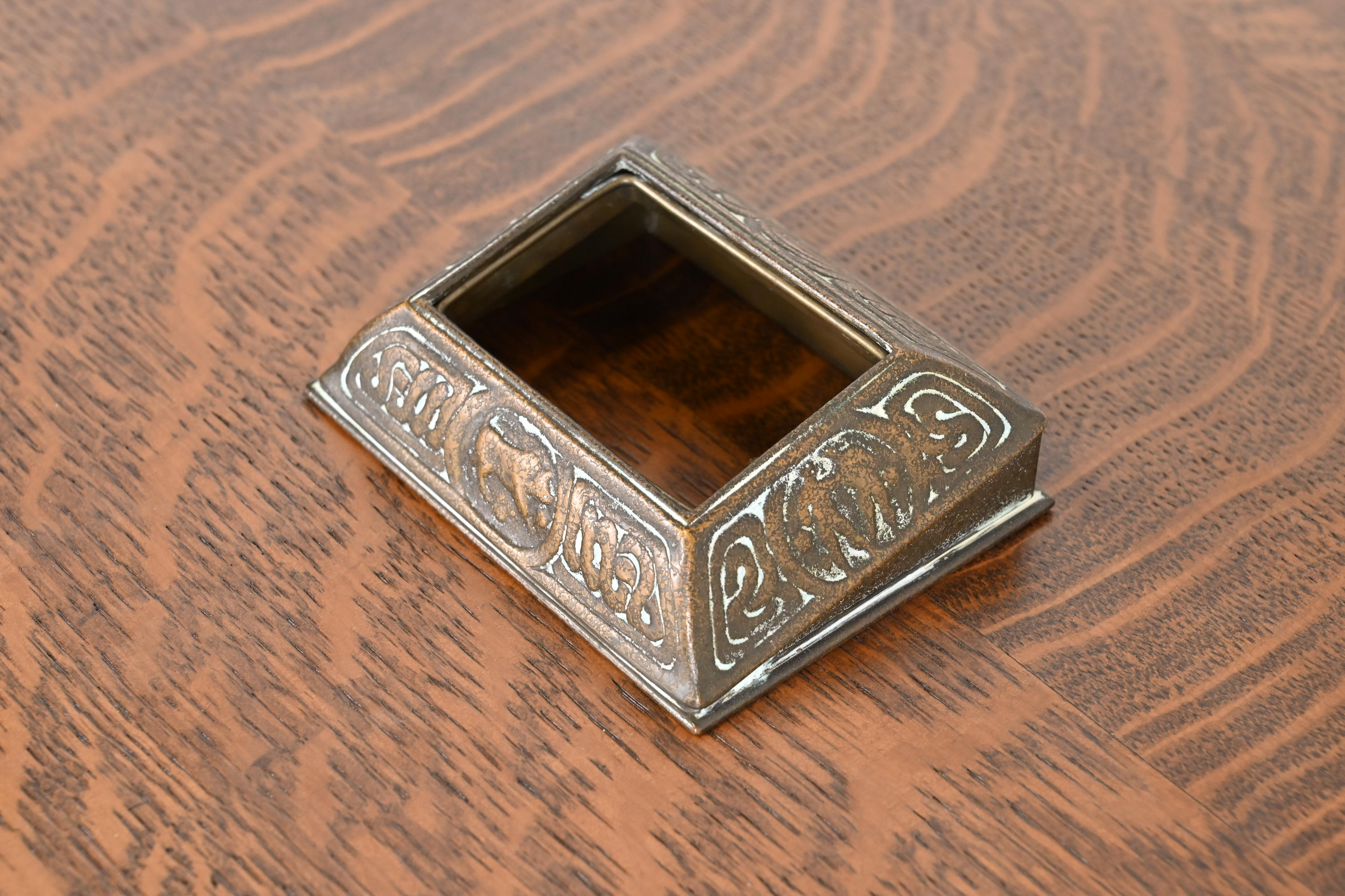 Tiffany Studios New York 'Zodiac' Bronze Desk Calendar Holder or Picture Frame, Circa 1910