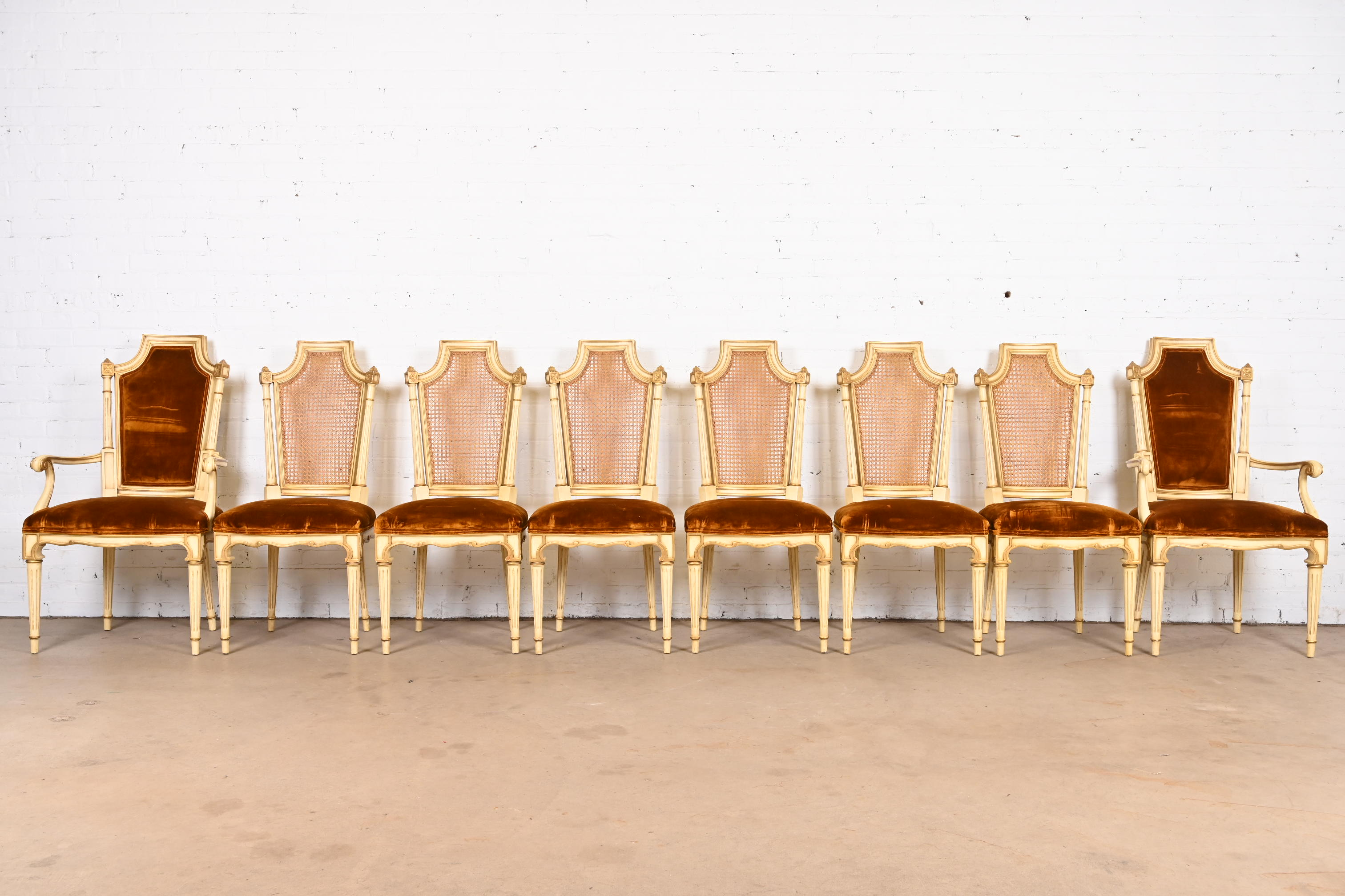 Karges French Regency Louis XVI Cream Painted and Gold Gilt Cane Back Dining Chairs, Set of Eight