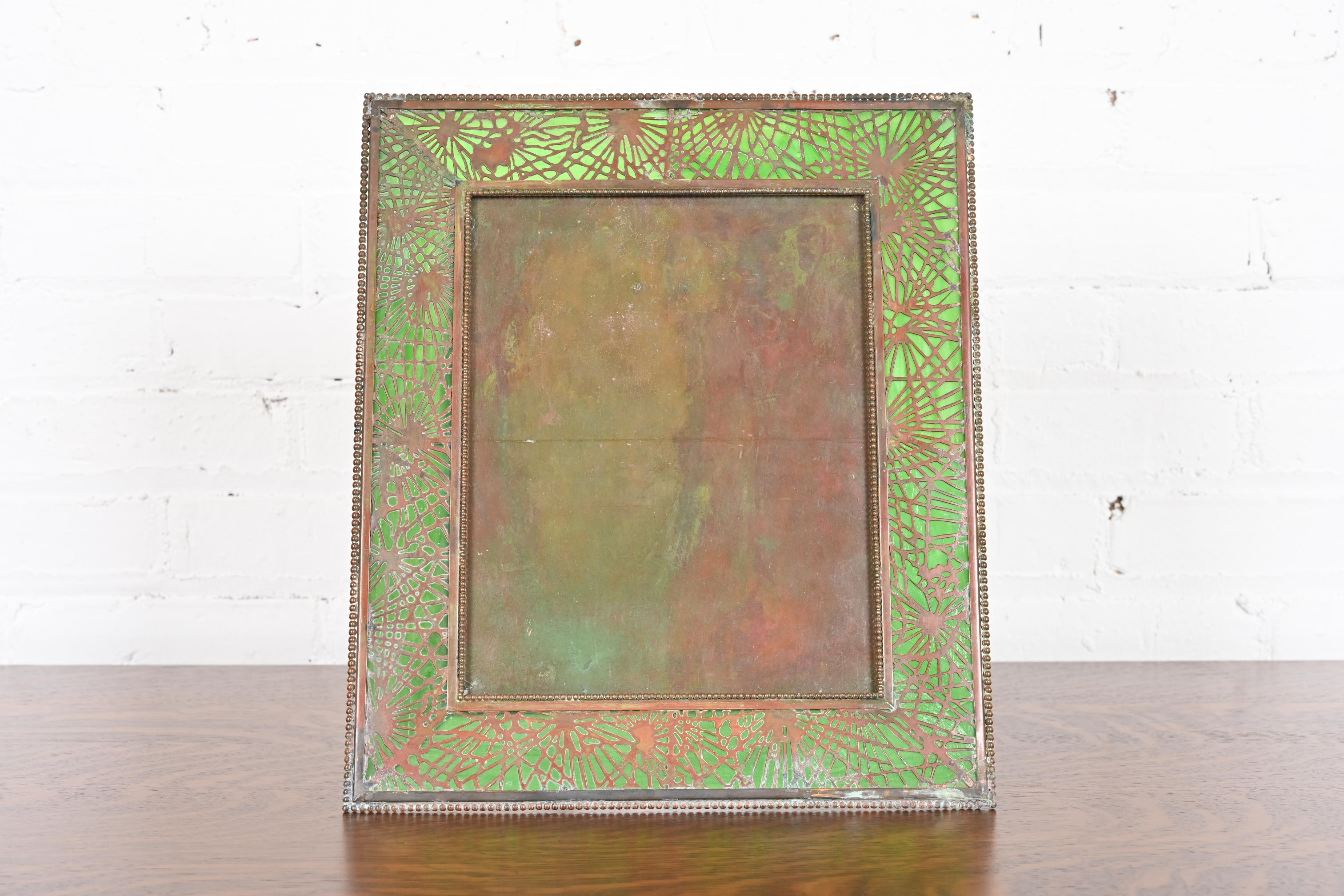 Tiffany Studios New York Pine Needle Bronze and Green Slag Glass Large Picture Frame, Circa 1910
