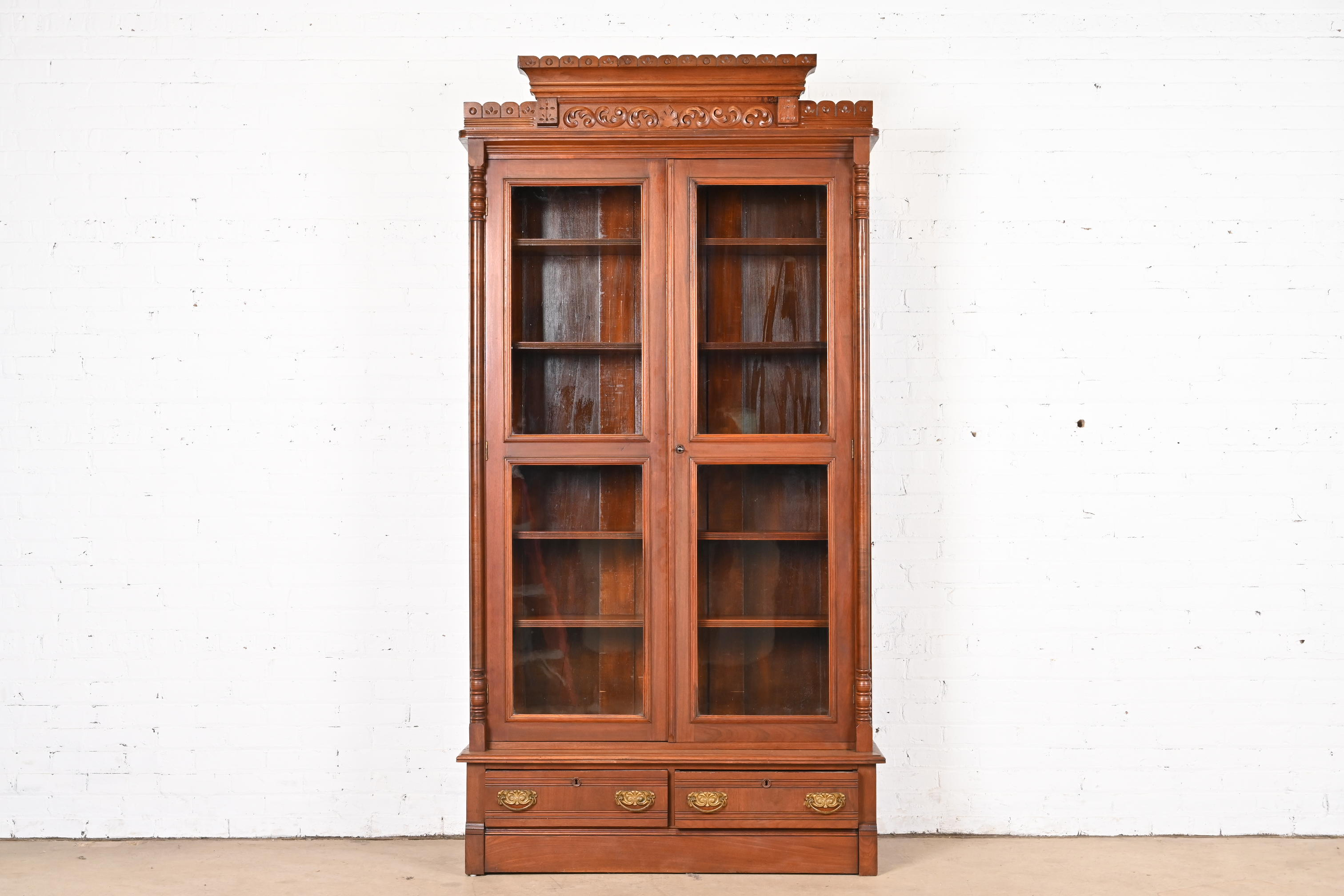 Herter Brothers Style Antique Eastlake Victorian Carved Walnut Bookcase, Circa 1880s