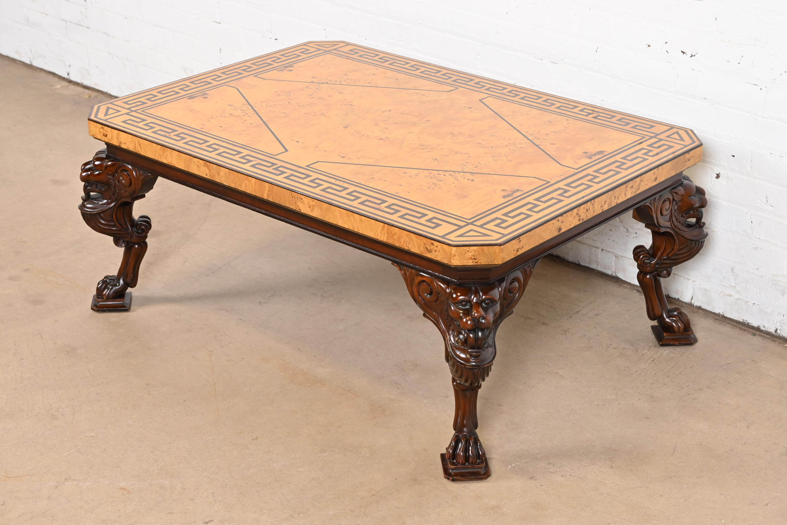 Baker Furniture Neoclassical Cocktail Table With Burl Wood Greek Key Top and Carved Mahogany Lion Legs