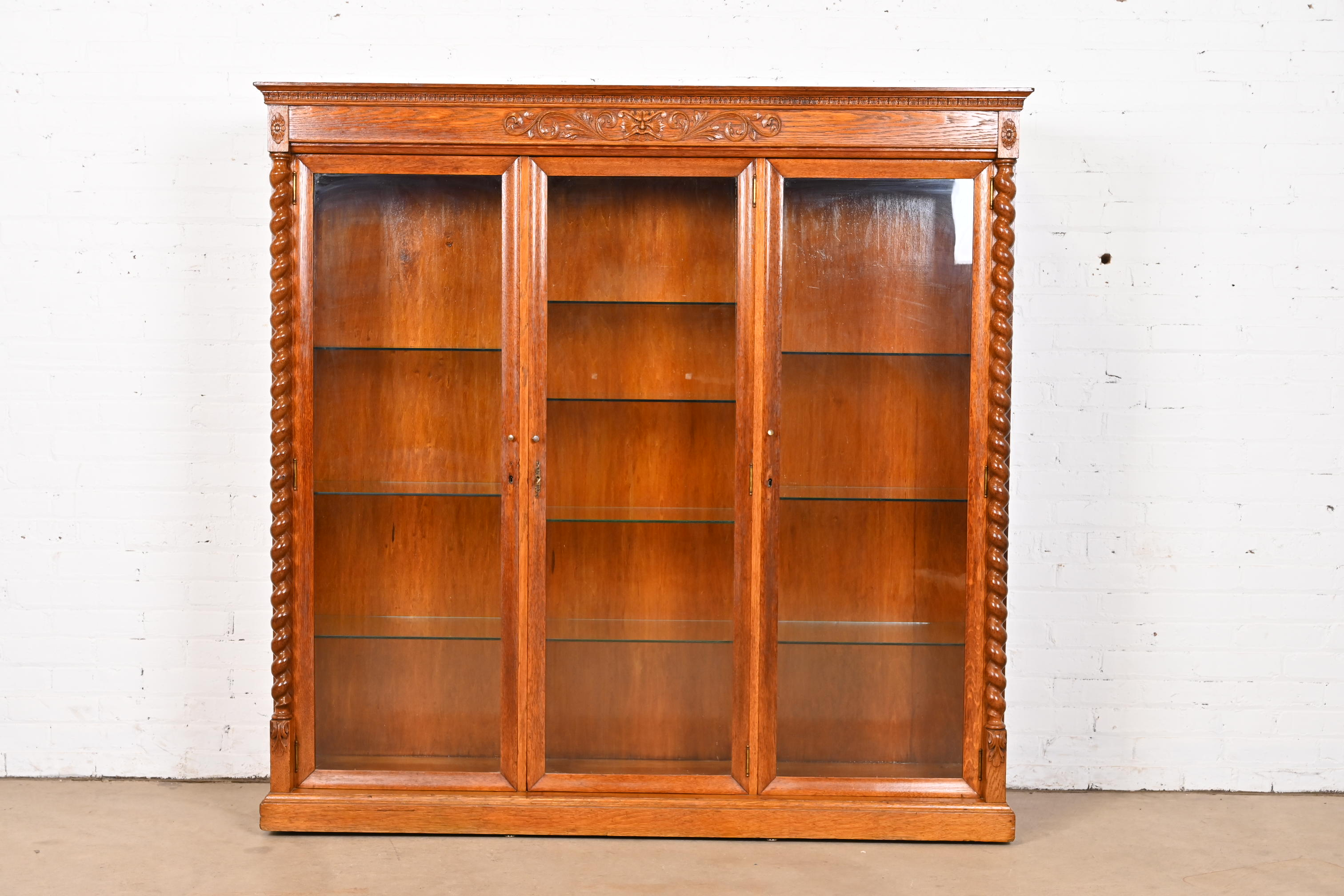 R. J. Horner Style Antique Victorian Carved Oak Lighted Triple Bookcase or Display Cabinet, Circa 1890s