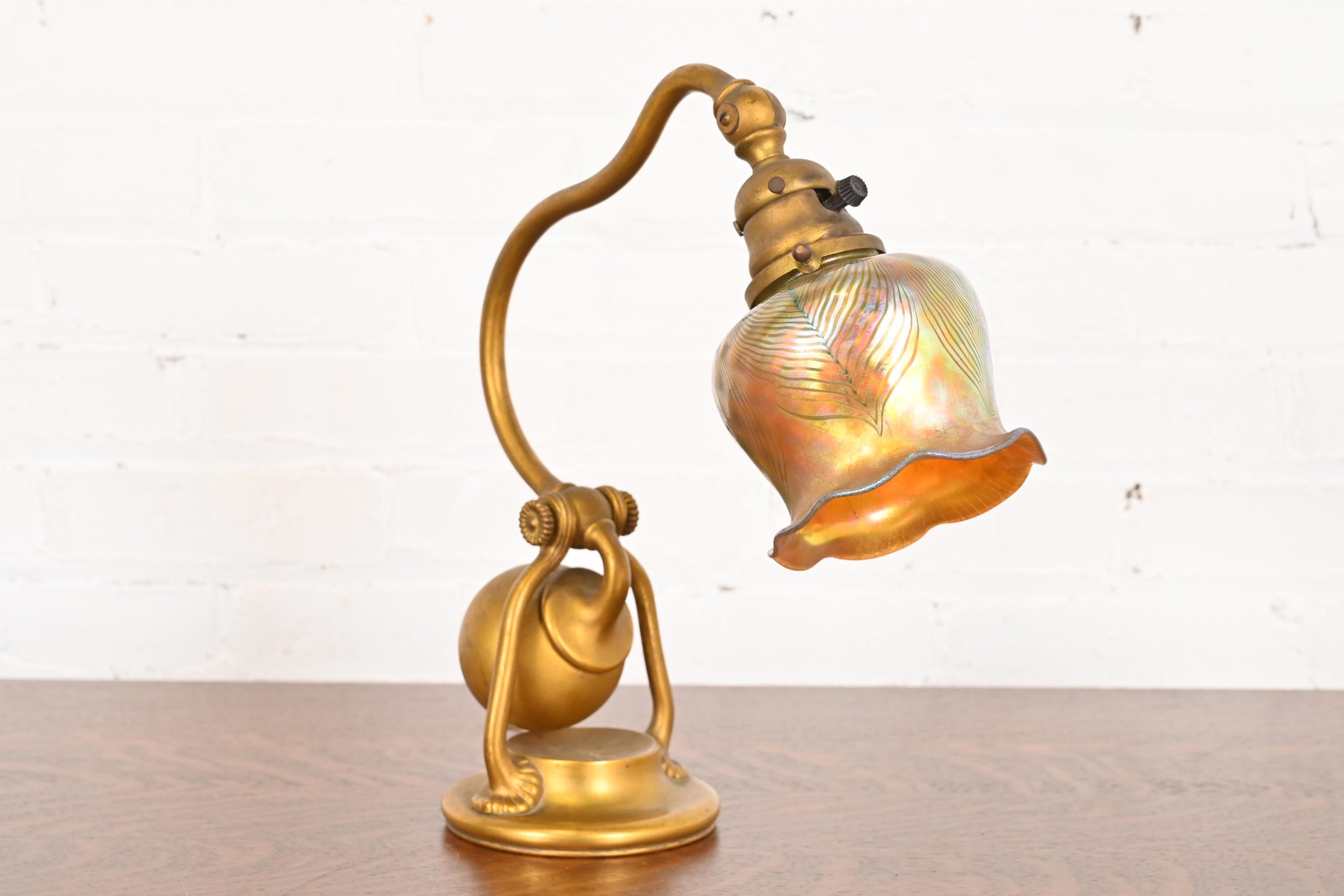 Tiffany Studios New York Bronze Doré Counterbalance Desk Lamp With Favrile Glass Pulled Feather Shade, Circa 1910