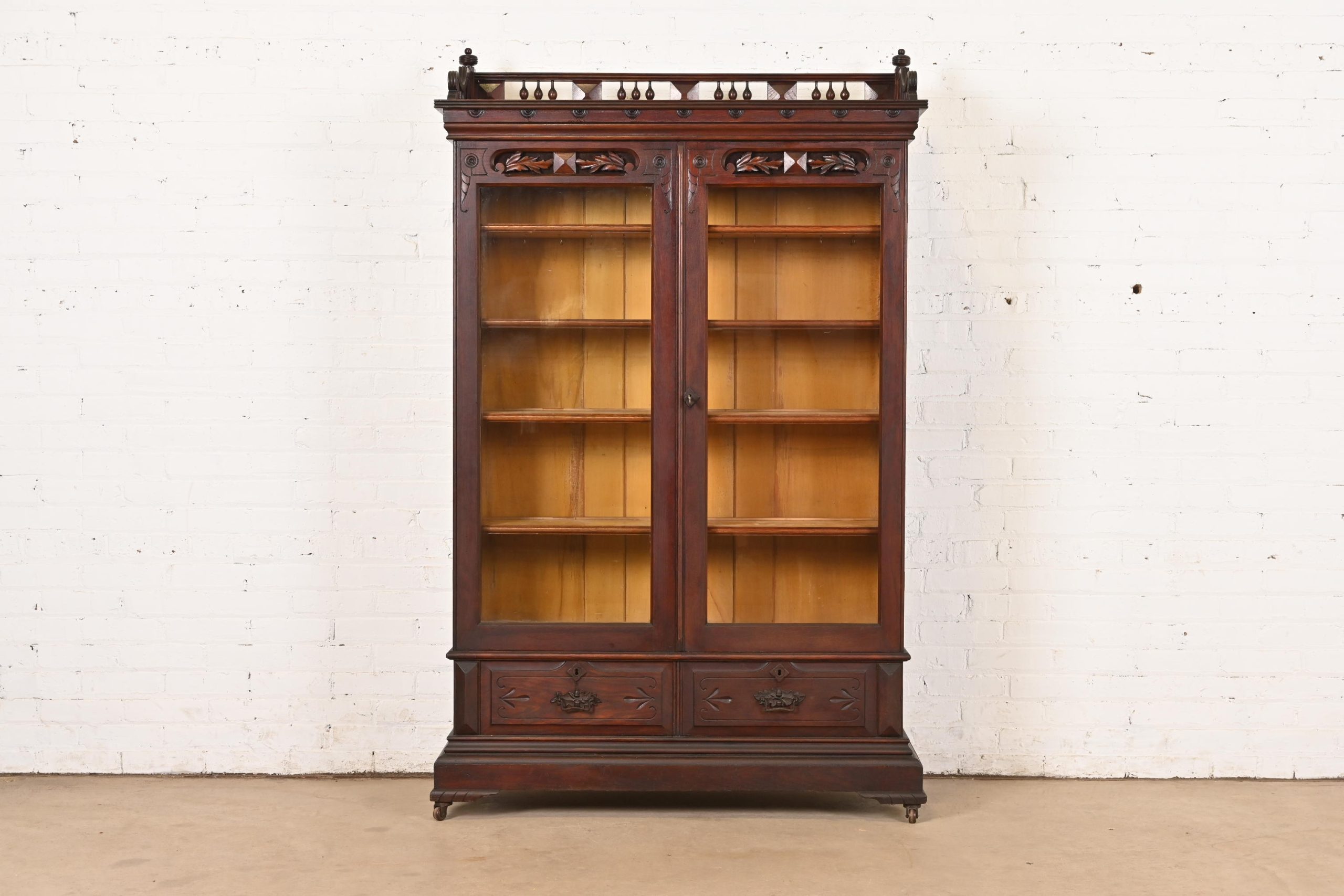 Herter Brothers Style Antique Eastlake Victorian Carved Walnut Bookcase Cabinet, Circa 1880s