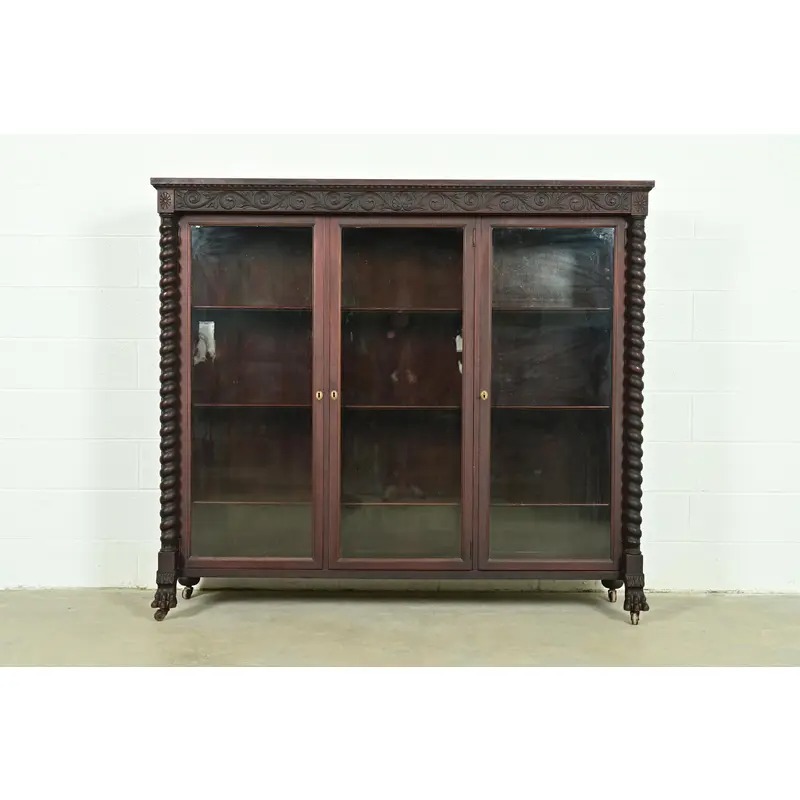 R. J. Horner Style American Empire Carved Mahogany Triple Bookcase With Lion Paw Feet, Circa 1890s