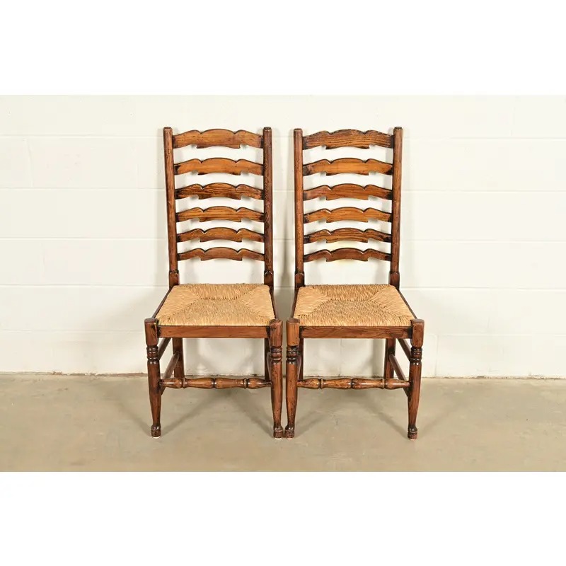 Baker Furniture Style English Country Rustic Carved Solid Oak Ladder Back Dining Chairs With Rush Seats, Pair