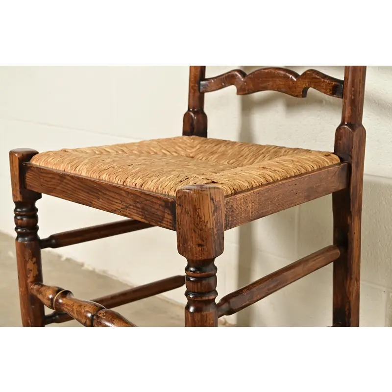 Baker Furniture Style English Country Rustic Carved Solid Oak Ladder Back Dining Chairs With Rush Seats, Pair - Image 9
