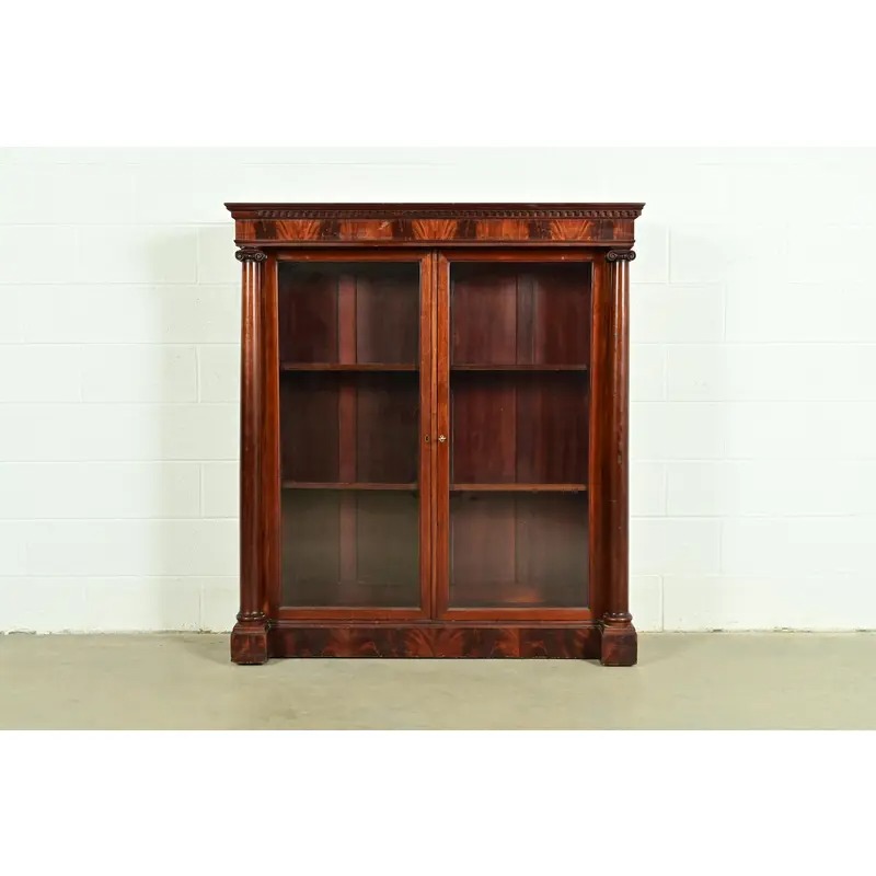 R. J. Horner Style American Empire Flame Mahogany Glass Front Double Bookcase, Circa 1880s