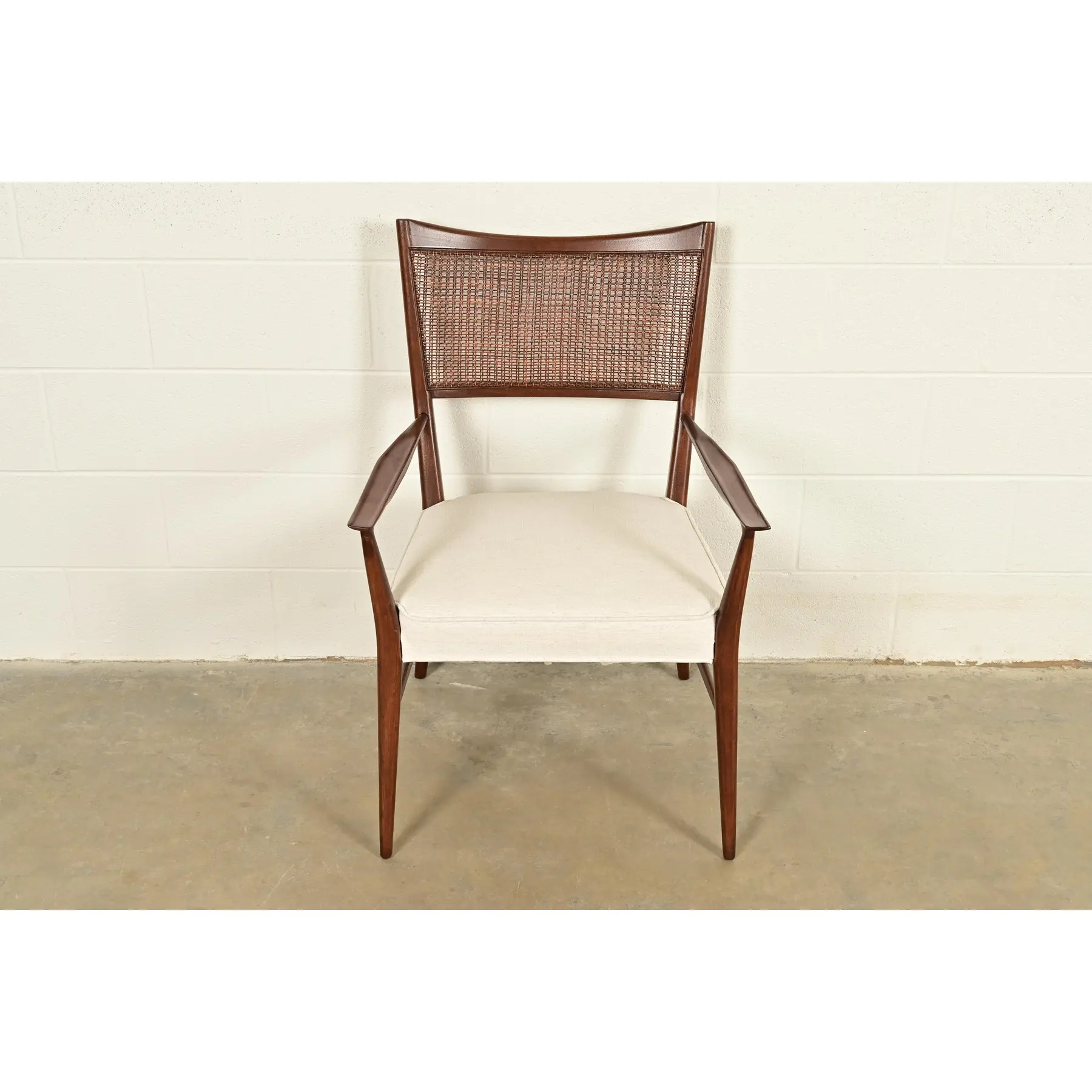 Paul McCobb Irwin Collection Mid-Century Modern Sculpted Walnut Cane Back Armchair, Newly Refinished