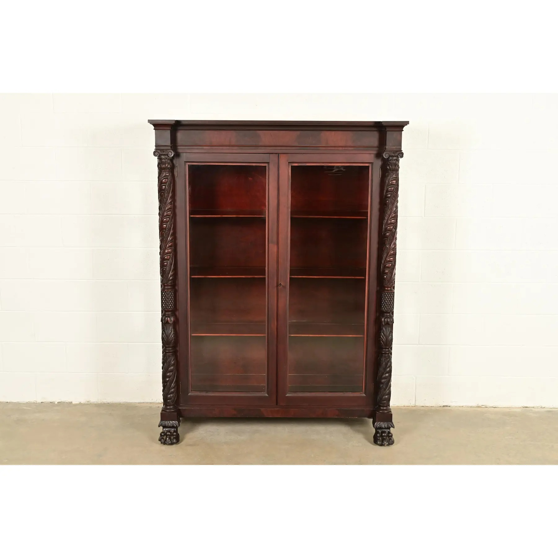 R. J. Horner Style Antique American Empire Flame Mahogany Glass Front Bookcase Cabinet, Circa 1890s