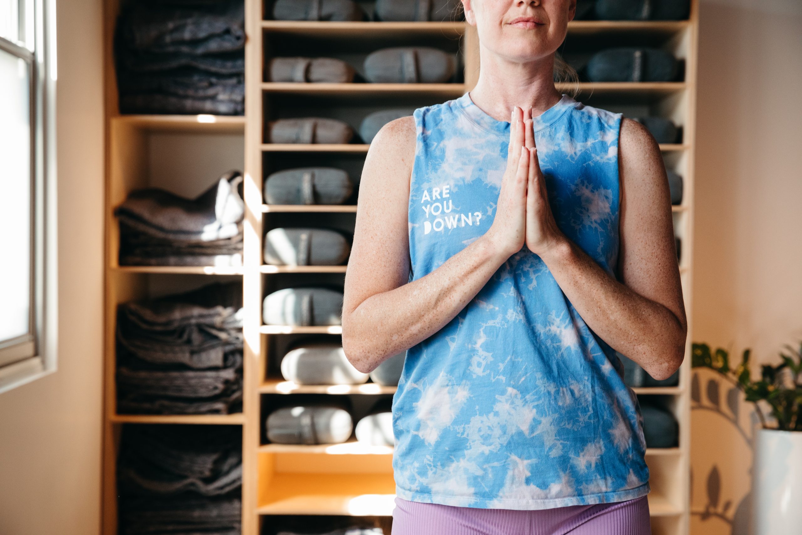 yoga student with hands at heart at yoga studio in Eagle Rock