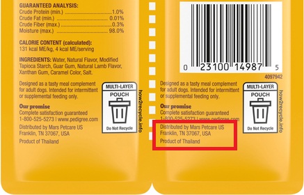 Pet food pouch label with the "Distributed by" guarantor statement highlighted in a red box.