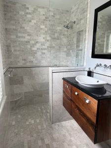 walk in shower with floating vanity