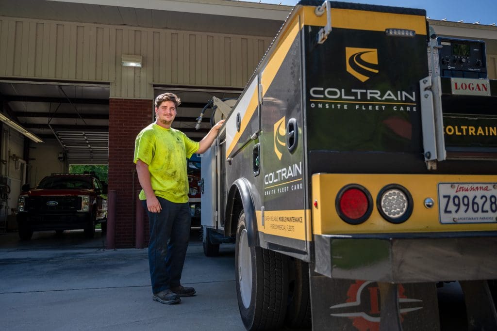 Coltrain mobile diesel technician beside a service truck, Hammond Louisiana