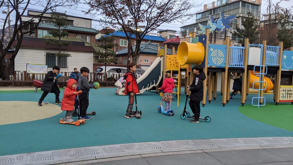 Our four-year-old joined the scooter gang at the playground across the street from our apartment. 