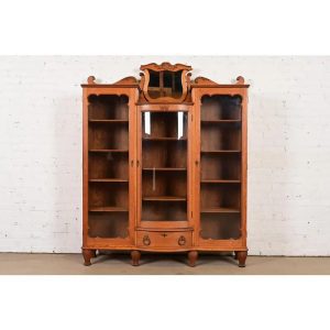 R. J. Horner Style Antique Victorian Carved Oak Triple Bookcase, Circa 1880s