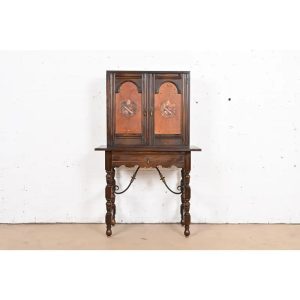 Baker Furniture Spanish Colonial Carved Oak Leather Front Bookcase or Bar Cabinet, Circa 1900