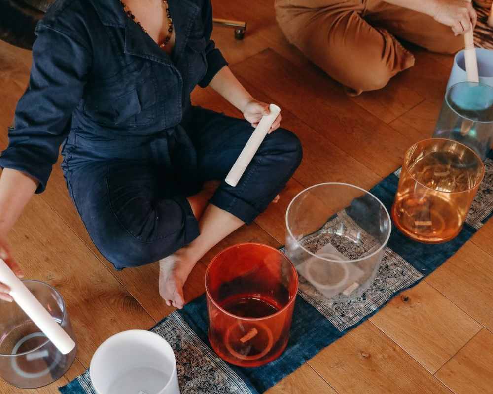 image of teacher using sound bowls, sound bath, stress reduction los angeles
