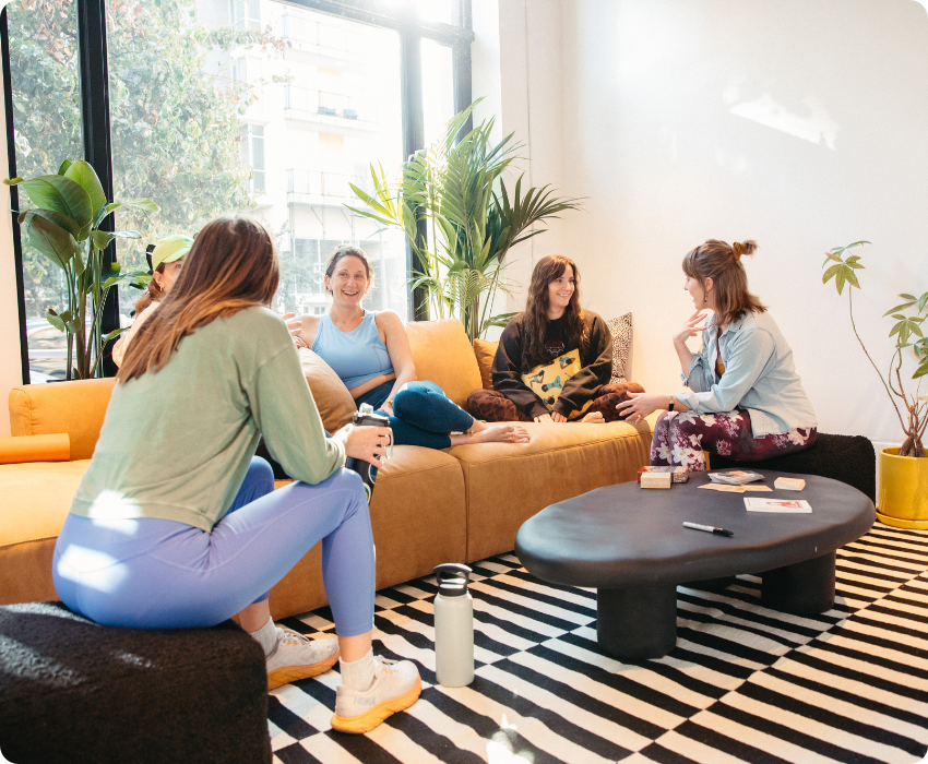 yoga students reading tarot cards and relaxing in a lounge at One Down Dog yoga studio East Hollywood LA