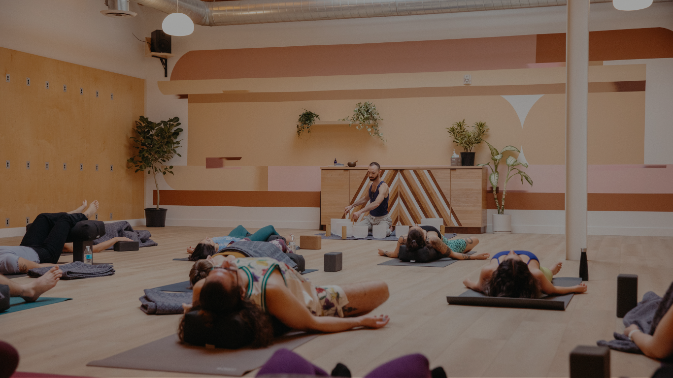 Yoga Students in a relaxing pose during a sound bath in East Hollywood, LA